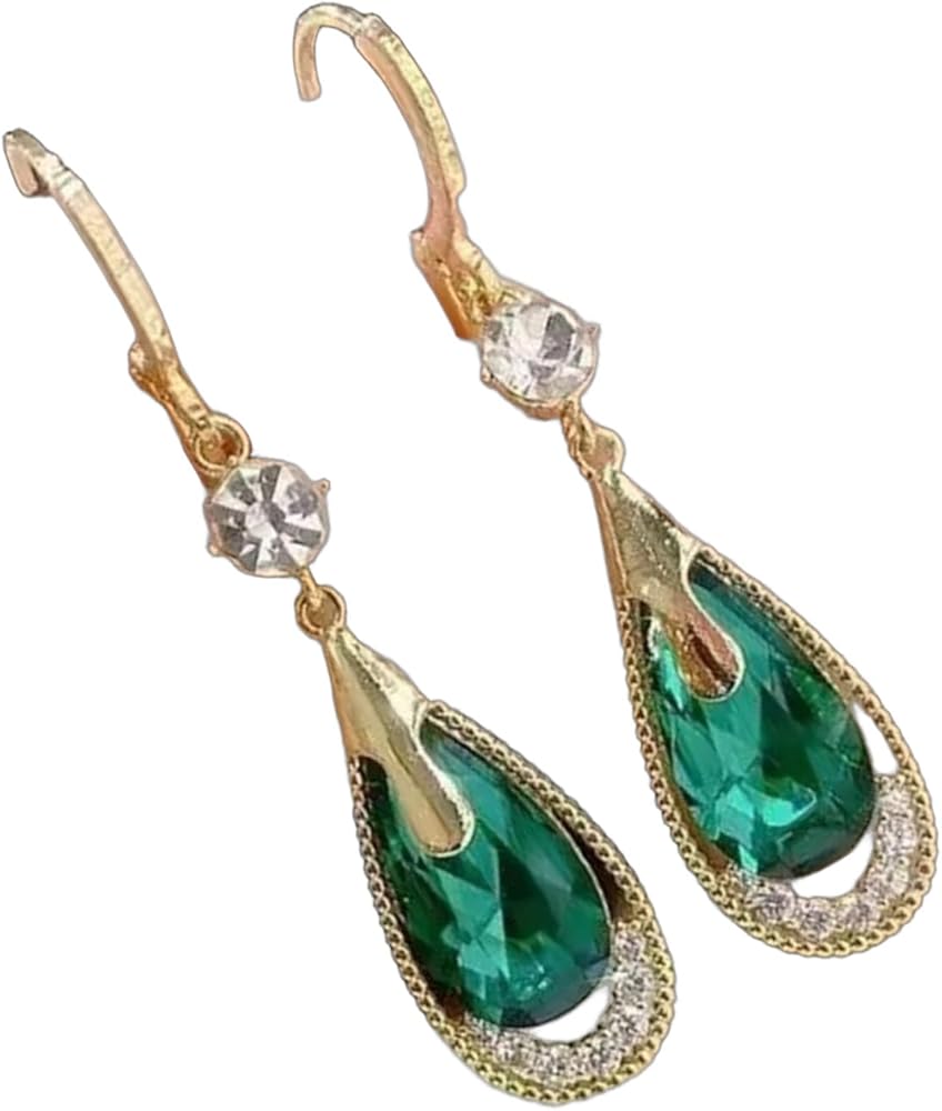 Boucles d'Oreilles
Cristal Émeraude
Goutte de lumière dorée ✨